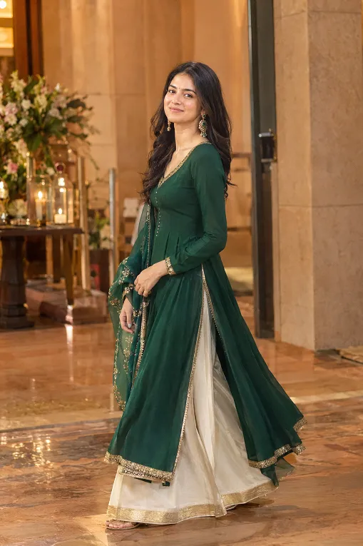 Anarkali with a high side slit worn over palazzo pants, shown mid-stride