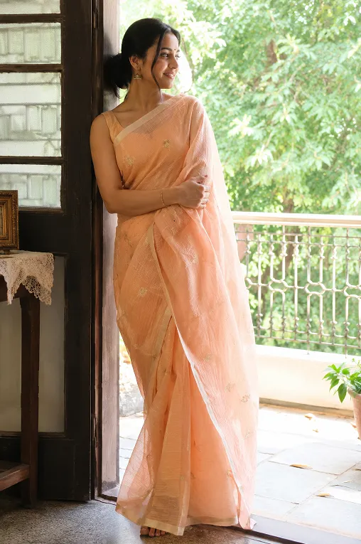 saree fabric for summer: woman in Kota Doria cotton saree