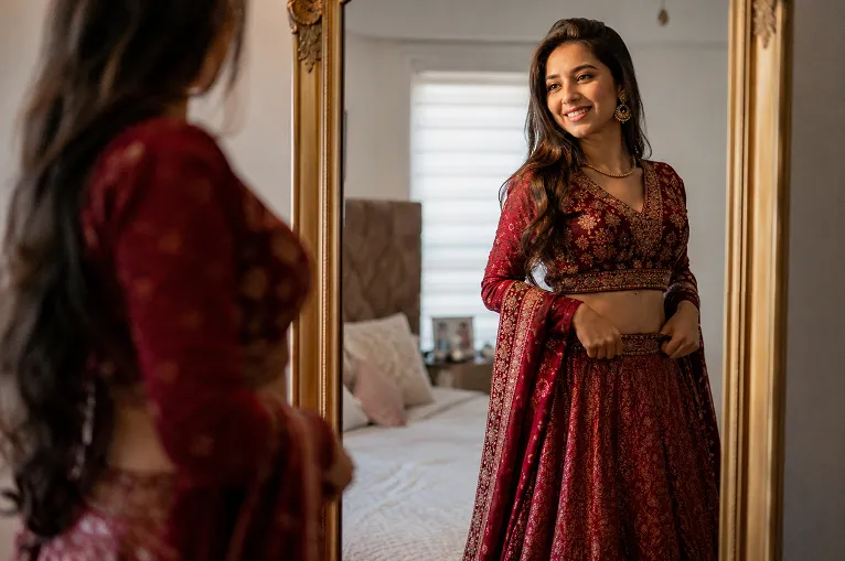 Short height Indian woman styling ethnic wear for short height in a cropped blouse and high-waisted lehenga