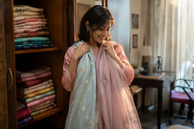 how many sarees do you need in your wardrobe, woman checking her collection