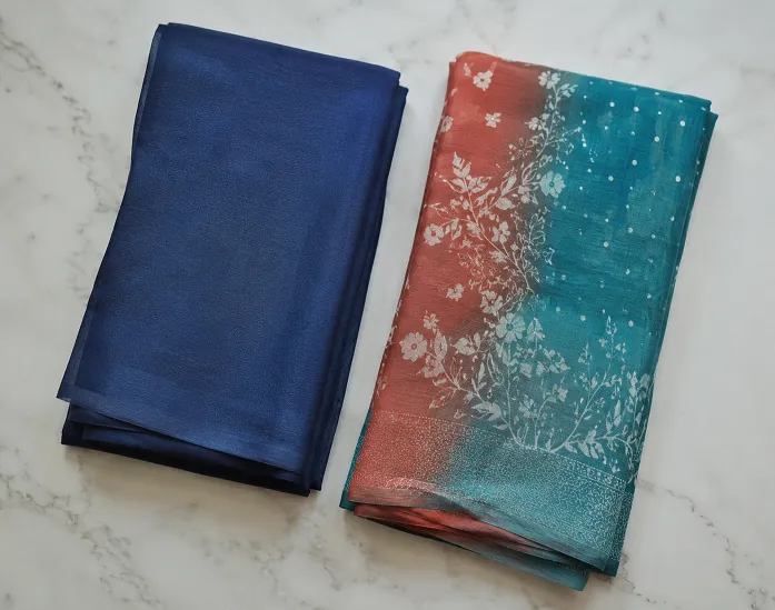 solid navy saree compared with a printed dual tone saree for monsoon fabric styling