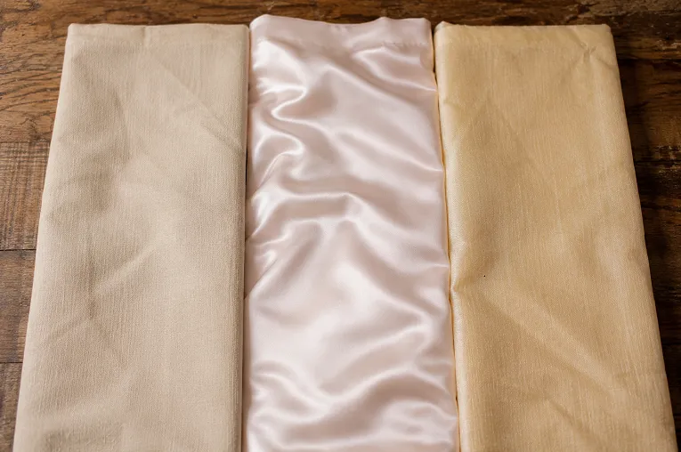 Cotton, satin and silk cotton blend petticoat fabric swatches compared