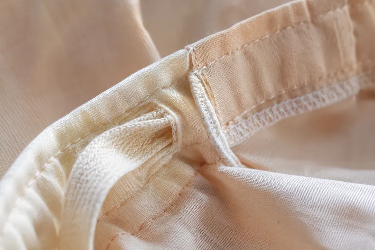 Close-up of petticoat drawstring channel and seam stitching quality