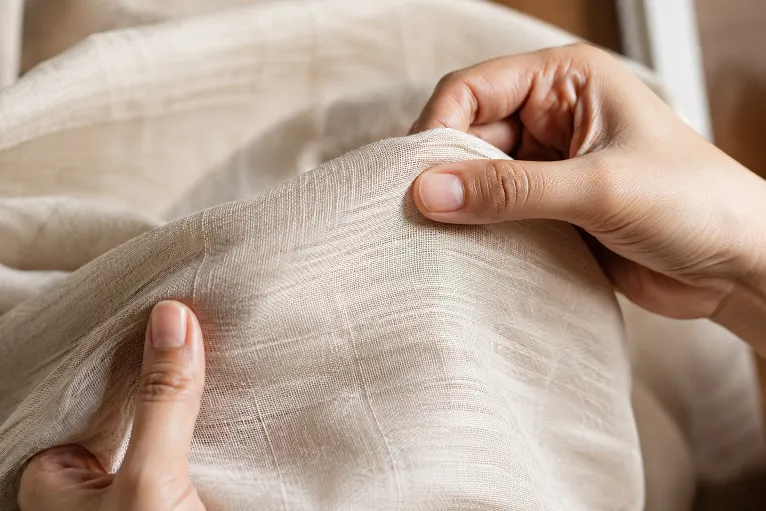 Close up of pure linen saree fabric showing natural slub texture used to identify real linen