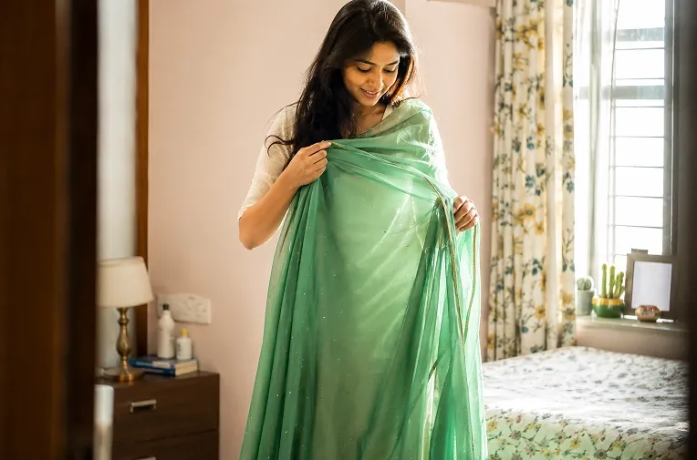 woman deciding whether to convert normal saree to ready to wear saree