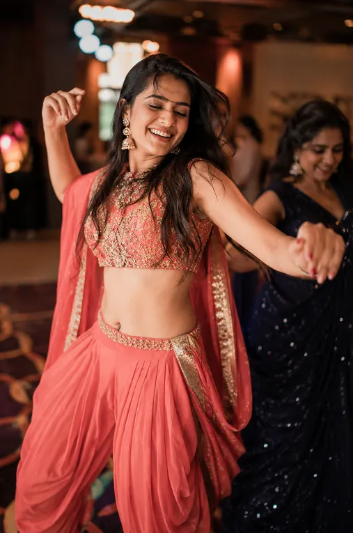 fusion crop top and dhoti pants styled for dancing at a sangeet function