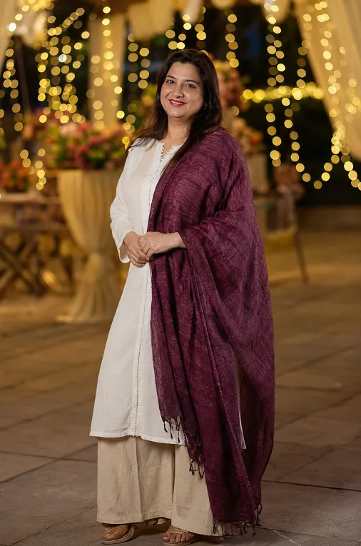 Plum tussar silk dupatta styled with a plain white kurti for a festive wedding guest look