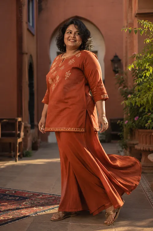 plus size woman wearing a matching ethnic co-ord kurta and palazzo set