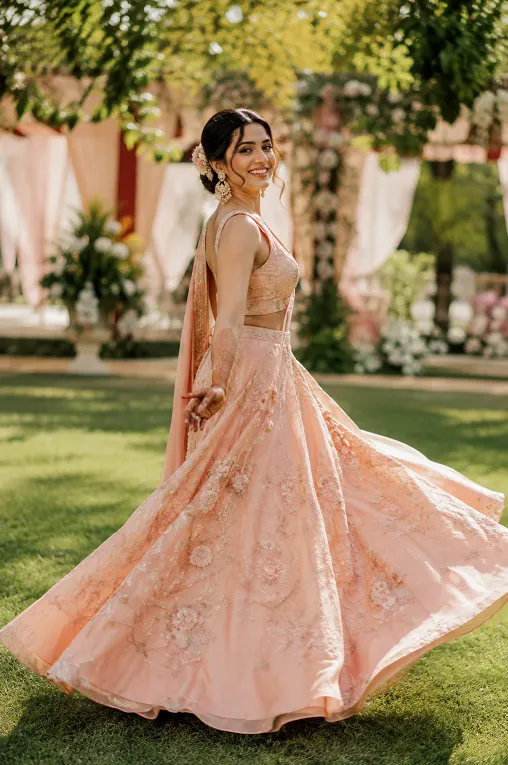 engagement outfit for bride to be in a pastel embroidered lehenga