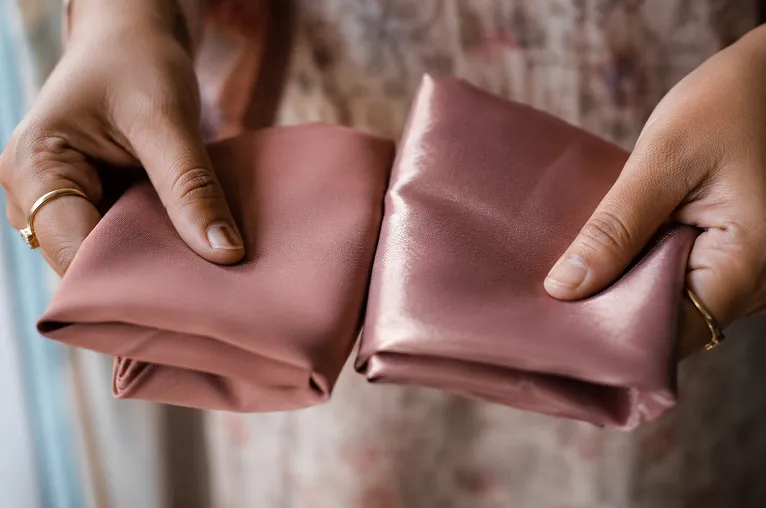 close up comparison of faux georgette fabric texture against pure silk georgette