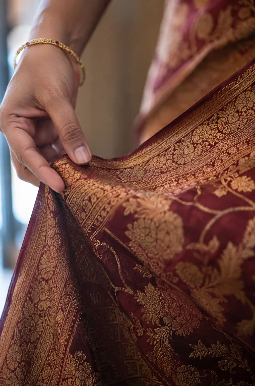 Close-up of heavy silk fabric with zari embroidery for a reception outfit
